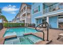Private pool and spa with patio furniture and a grill at 3056 Parrot Head Pl, Kissimmee, FL 34747