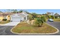 House with a two-car garage and a spacious yard at 3965 Journey Ct, Casselberry, FL 32707