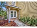 Front entrance with double doors and a welcoming mat at 1445 Creekside Cir, Winter Springs, FL 32708