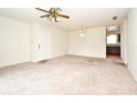 Living room with carpeted floors, ceiling fan, and access to sliding doors at 3054 George Mason Ave # 6, Winter Park, FL 32792