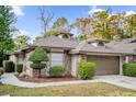 House exterior showcasing a well-maintained lawn and landscaping at 314 Macgregor Rd, Winter Springs, FL 32708