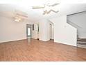 Living room with wood-look floors and ceiling fan at 3358 Cedar Springs Pl # 159, Winter Park, FL 32792