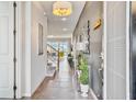 Entryway with tiled flooring, a console table, and access to the living area at 1567 Carey Palm Cir, Kissimmee, FL 34747
