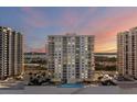 Oceanfront condo at sunset with illuminated windows at 2967 S Atlantic Ave # 504, Daytona Beach Shores, FL 32118