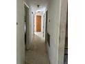 Long hallway with multiple doors to bedrooms at 1918 Mountain Lake Cutoff Rd, Lake Wales, FL 33859