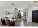 Cozy living room decorated for the holidays with comfortable seating and a Christmas tree at 2213 Grantham Ave, Davenport, FL 33837