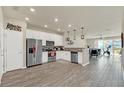 Modern kitchen with stainless steel appliances and white cabinetry at 3780 Plainview Dr, Orlando, FL 32824