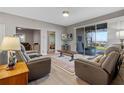 Living room with a view of the lake, comfortable seating and a TV at 3528 Chapel Hill Blvd, Clermont, FL 34711