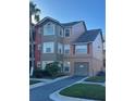 Two-story condo with attached garage and landscaping at 2208 Antigua Pl # 924, Kissimmee, FL 34741