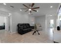 Living room with sectional sofa and recliner at 2267 Canyon Breeze Ave, Kissimmee, FL 34746