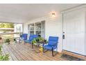 Covered porch with wooden flooring and blue chairs at 2917 Crockett Pt, Sanford, FL 32773