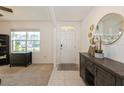 Bright and airy entryway with a contemporary console table and mirror at 3282 Eastgrove Ter, Sanford, FL 32771