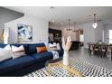 Open living space featuring stylish furniture and a modern aesthetic at 212 Villa Domani Cir, Davenport, FL 33896