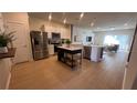 Modern kitchen with stainless steel appliances and an island at 2774 Bright Bird Ln, Winter Park, FL 32792