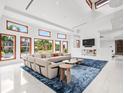 Open living space featuring a sectional sofa and large windows at 10230 Park Ridge Gotha Rd, Windermere, FL 34786