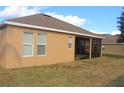 House exterior showcasing a screened patio at 428 Palastro Ave, Auburndale, FL 33823