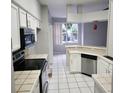 Kitchen with stainless steel appliances and tile flooring at 433 Eastbridge Dr, Oviedo, FL 32765