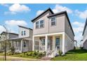Modern two-story home with neutral siding and a landscaped front yard at 4970 Citrus Leaf Blvd, Winter Garden, FL 34787