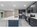 Modern kitchen with stainless steel appliances and an island at 510 Palm Ave, Eustis, FL 32726