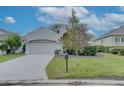 House exterior featuring a driveway and landscaping at 1175 Chessington Cir, Lake Mary, FL 32746