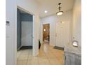 Bright and spacious entrance hall with tile flooring and views to other rooms at 1542 Travertine Ter, Sanford, FL 32771