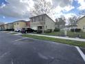 Two-story house with a car parked in front at 572 Cresting Oak Cir # 19, Orlando, FL 32824