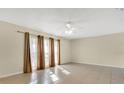 Spacious living room with tile floors and sliding doors at 7201 Pleasant Dr, Orlando, FL 32818