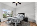 Cozy bedroom with a double bed, rug, and large window at 8931 Bismarck Palm Rd, Kissimmee, FL 34747