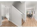 Bright interior hallway with light wood floors, showing access to other rooms at 8931 Bismarck Palm Rd, Kissimmee, FL 34747