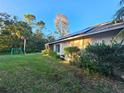 Large backyard with solar panels and a swing set at 1022 Bartlett Ct, Oviedo, FL 32765