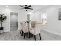 Bright dining area with a glass table and upholstered chairs at 1441 Dann St, Orlando, FL 32804