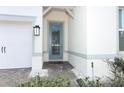 Front entry with blue door and stone pathway at 3449 Michigan St, Lake Mary, FL 32746
