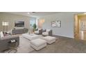 Living room featuring a neutral color palette and comfortable seating at 1245 Limbali St, Mount Dora, FL 32757