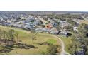 Aerial view showing home's location in a community near a golf course at 128 Higher Combe Dr, Davenport, FL 33897