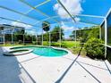 Screened pool and spa with a spacious deck at 1748 Golfview Dr, Kissimmee, FL 34746