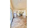 Modern kitchen with white cabinets, granite countertops, and gray island at 322 N 6Th St, Haines City, FL 33844