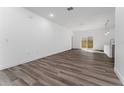 Bright living room featuring wood-look flooring and sliding doors at 6264 Sw 144Th Pl, Ocala, FL 34473