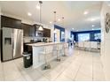 Modern kitchen with stainless steel appliances and granite countertops at 8956 Zurich Ln, Kissimmee, FL 34747