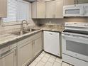 Modern kitchen with granite countertops and stainless steel appliances at 152 Springwood Cir # B, Longwood, FL 32750