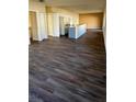 Open concept living area showcasing a kitchen with an island and hardwood floors at 314 N 6Th St, Haines City, FL 33844