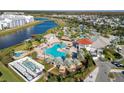 Community pool with a large deck and lounge area at 4563 Narrative Ln, Kissimmee, FL 34746
