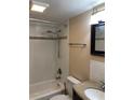 Clean bathroom with tub shower, tile walls, and granite vanity at 327 Scottsdale Sq # 327, Winter Park, FL 32792