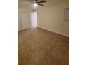 Spacious bedroom with tile flooring and ample closet space at 347 Scottsdale Sq # 347, Winter Park, FL 32792