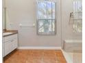 Bathroom with tiled floor, walk-in shower, and vanity at 839 Franconville Ct, Kissimmee, FL 34759