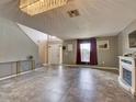 Open living area with tile floors and high ceilings at 224 Fairfield Dr, Sanford, FL 32771