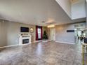 Spacious living room with tile floors, fireplace, and large windows at 224 Fairfield Dr, Sanford, FL 32771