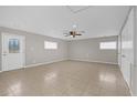 Bright bonus room featuring tile flooring and multiple closets at 2762 Hilda Cv, Winter Park, FL 32792