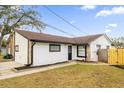 Newly painted house exterior with well-maintained lawn at 2762 Hilda Cv, Winter Park, FL 32792