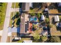 Aerial view showing house with pool and solar panels at 2825 Beal St, Deltona, FL 32738
