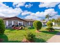 House exterior showcasing landscaping and a spacious yard at 2825 Beal St, Deltona, FL 32738